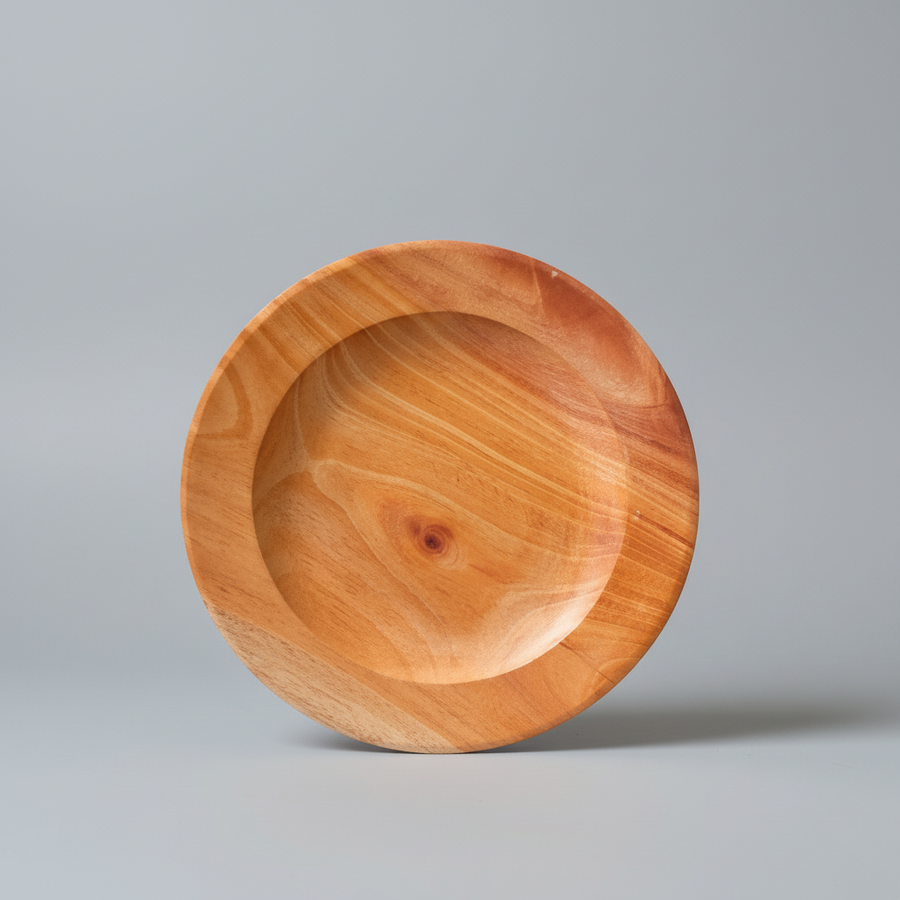 Wooden plate on a gray background with text 'Piring kayu saji'.